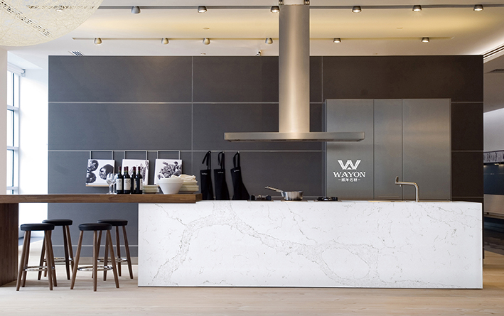 The square floor is paved with black and white terrazzo